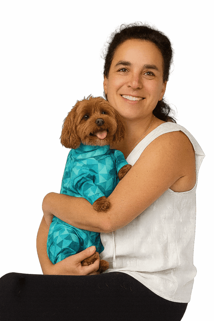 Pet owner holding a dog wearing a Pet Pjs recovery suit