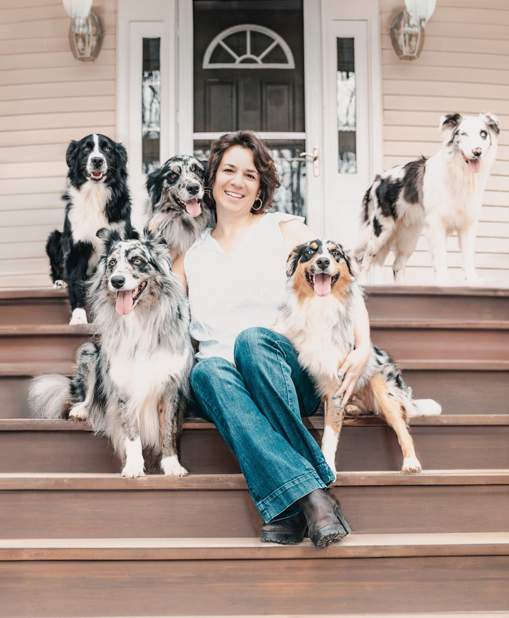 Veterinarian Vanessa Ferraz with dogs wearing Pet Pjs recovery suits