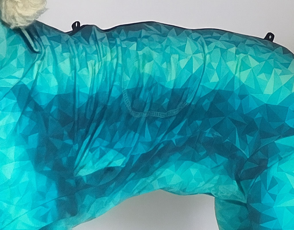 Close-up of a teal and blue geometric-patterned fabric