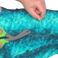 Cutting openings in a recovery suit to allow surgical drains or tubes