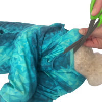 Cutting the protective sleeve for a female dog recovery suit